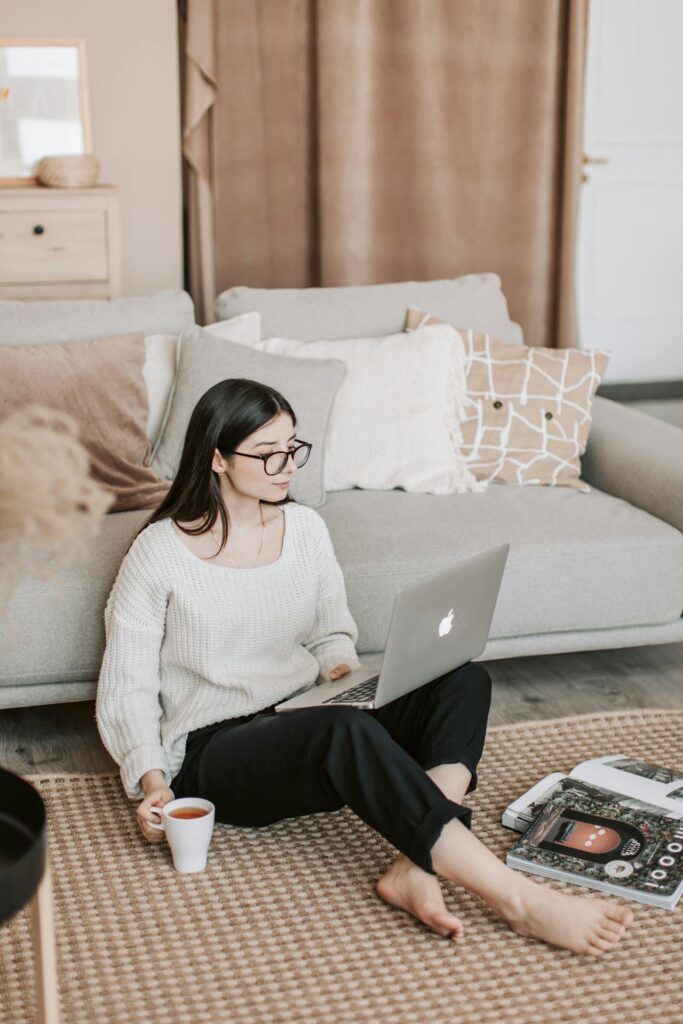 Woman studying on a laptop during online real estate classes in Florida